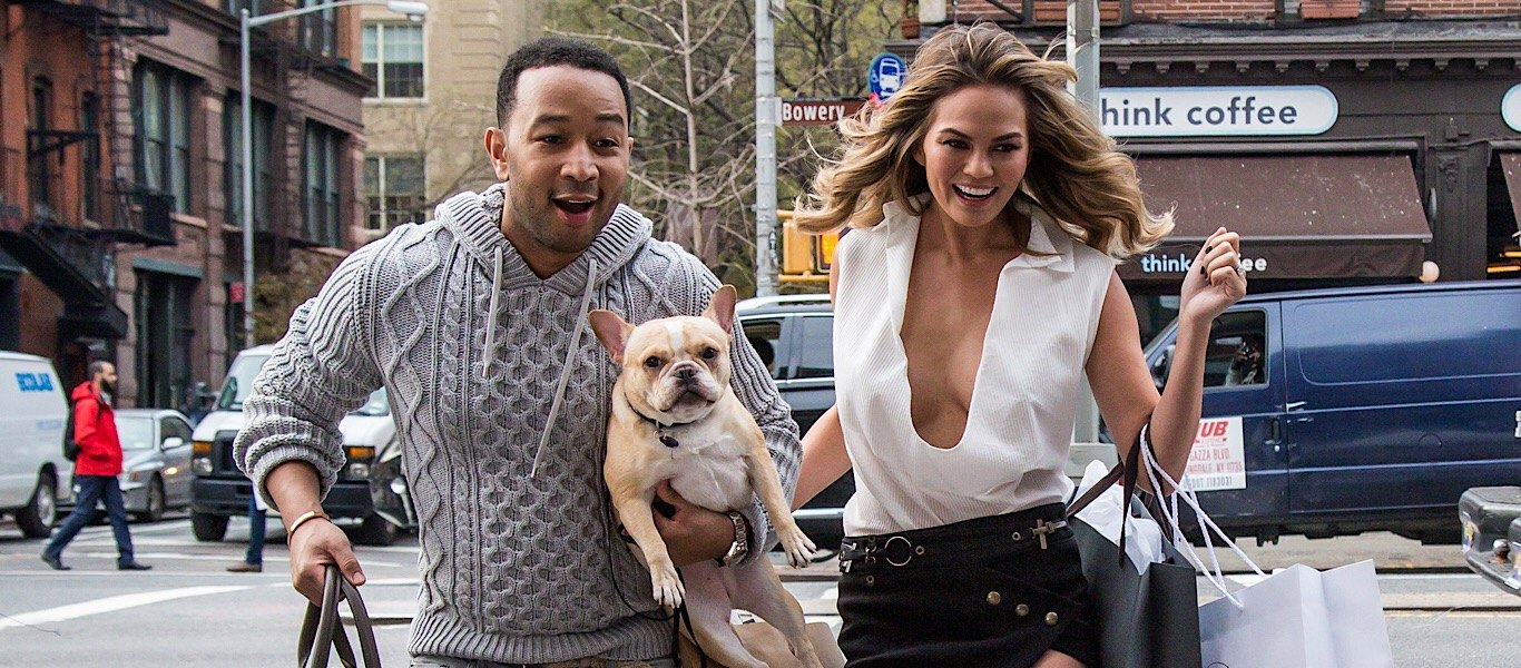 John Legend and Chrissy Teigen with their dog