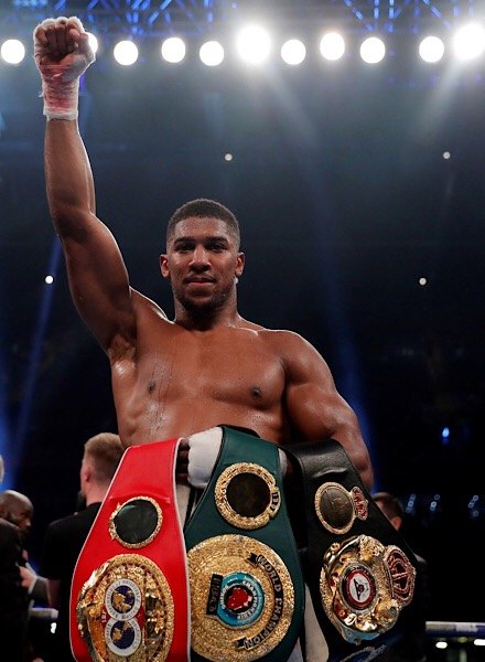 Anthony Joshua with belts