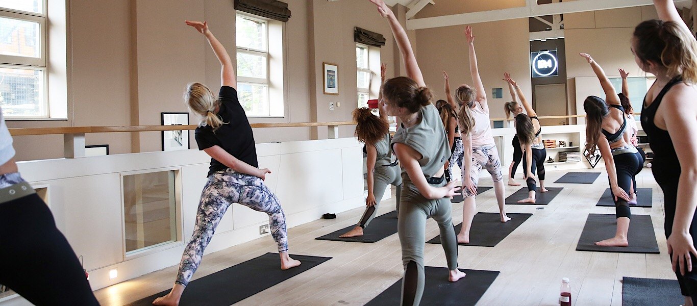 yoga class in pink soda sport