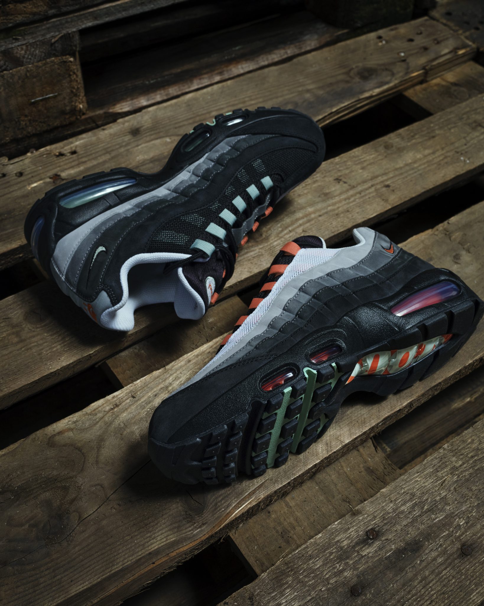 Nike Air Max 95 Liverpool JD Exclusive IX7923-001 hero image showing Rust Factor and Steam palette with brick-inspired reflective foxing and Scouse cultural detailing